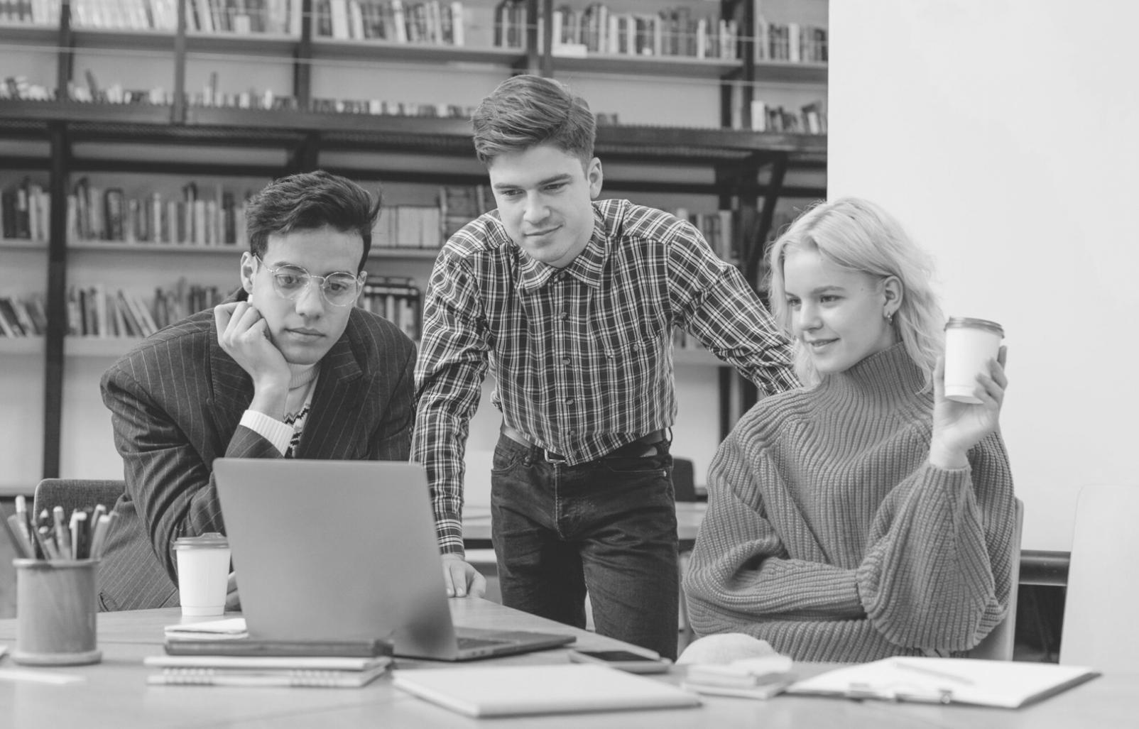 Trading classroom setup with students analyzing live market data on screens