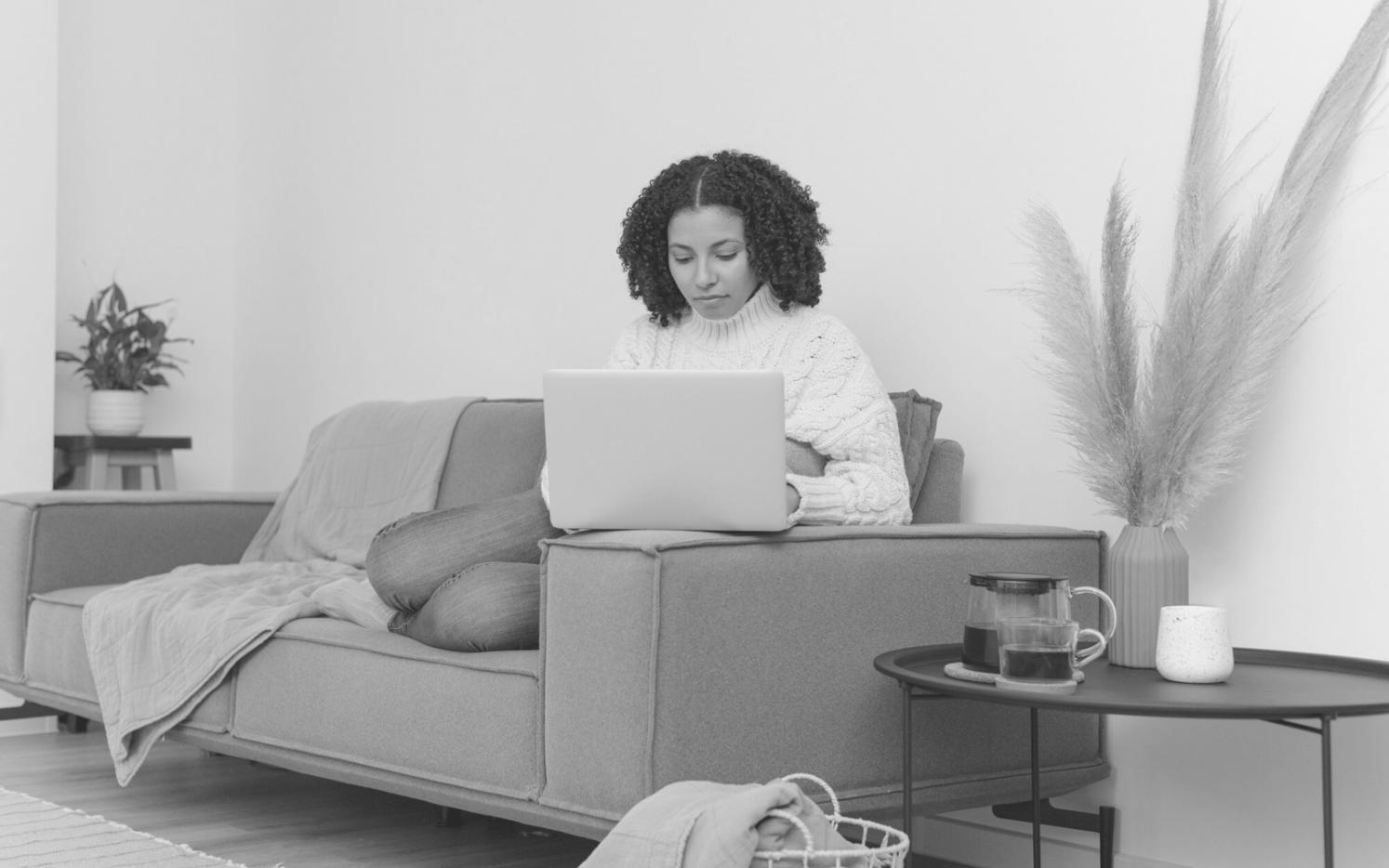 Student working through trading scenarios on multiple screens
